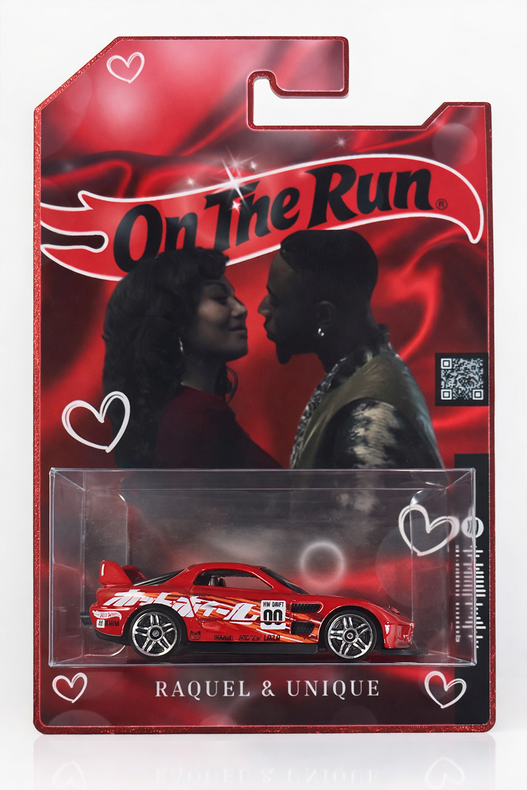 Custom couple themed display case with a red model sports car and personalized names on a decorative background with hearts